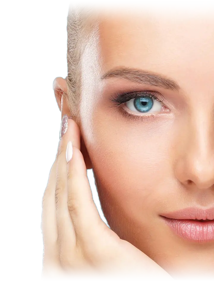 Woman with clear, glowing skin touching her face